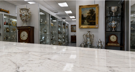 Interior view of antique displays and silver collectibles at Kingsland Antiques